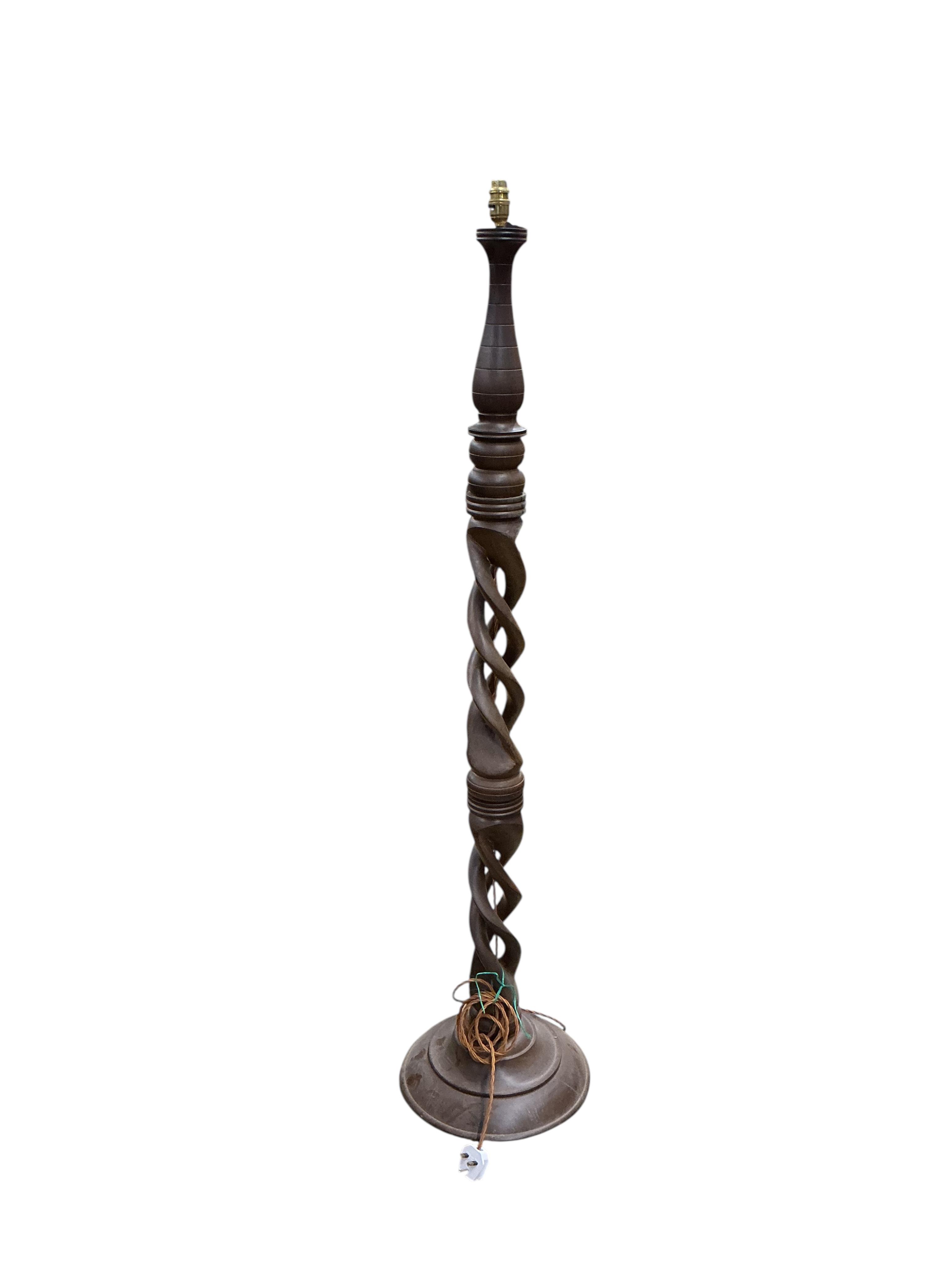 A carved hardwood open twist standard lamp, (re-wired), height 156cm